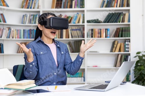 Preview: Woman using virtual reality headset in a library setting with laptop