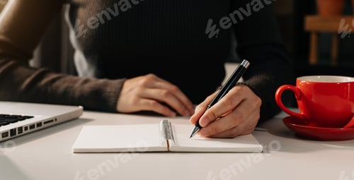 Preview: businesswoman hand working with new modern computer and writing on the notepad strategy