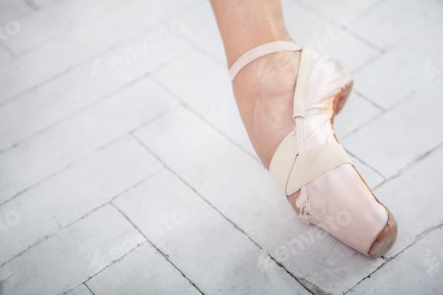 Preview: the leg of a ballerina on white background