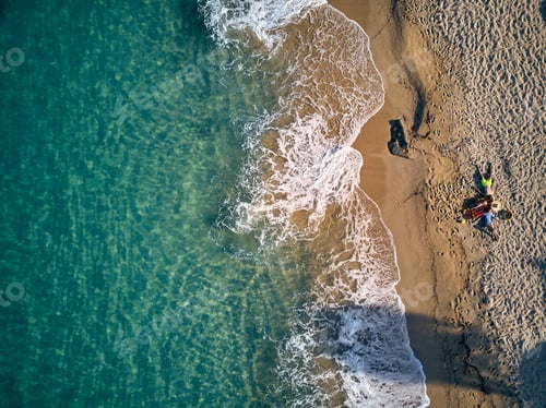 Preview: Beautiful beach with family top view shot