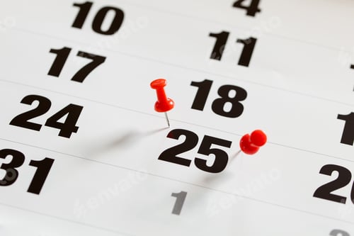 Preview: Pin pushed on a calendar concept for an important day.