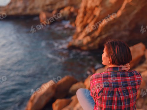 Preview: Young woman hiking on rocky beach in Spain, Benidorm