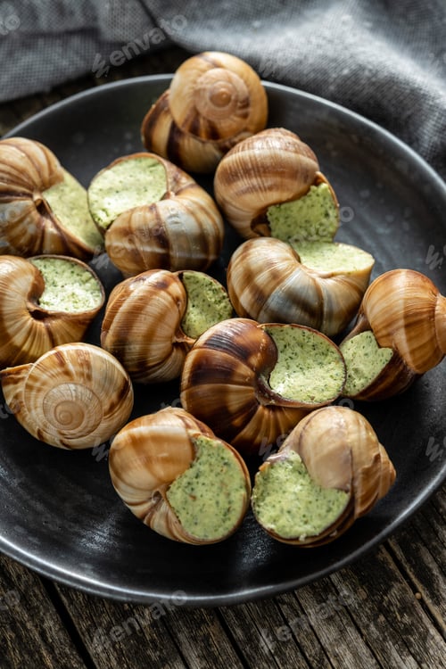Preview: Snails with parsley butter, Bourgogne Escargot Snails on plate. Delikatese food.