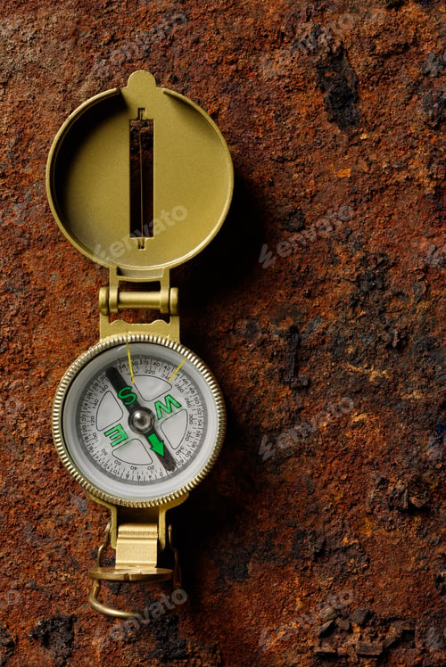 Preview: Magnetic compass on rough rusty background