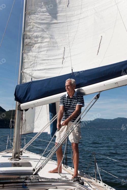 Preview: Older man sailing on lake