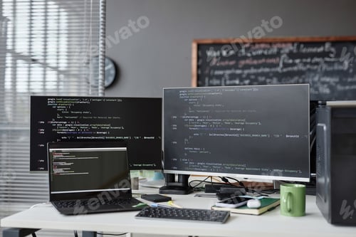 Preview: Workplace of programmer with computers in office