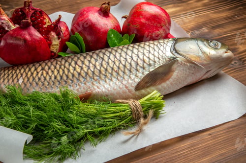 Preview: front view fresh fish with pomegranates on brown wooden desk ocean food sea seafood