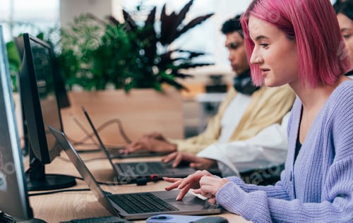 Preview: young programmers working on a new project for a start up business.