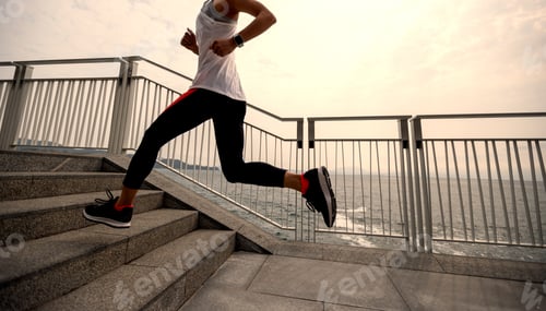 Preview: Healthy lifestyle fitness sports woman runner running on seaside trail