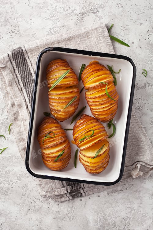 Preview: baked hasselback potato with cheddar cheese and rosemary