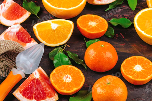 Preview: Sliced citrus fuits juicy on table close up