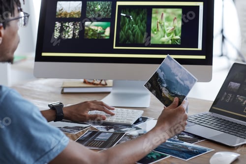 Preview: African-American Photographer Editing Pictures