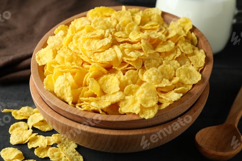 Preview: Concept of tasty breakfast with cornflakes on wooden table