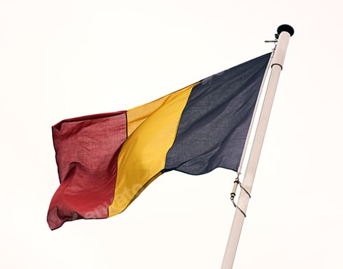 Preview: The flag of Belgium. Shot of the Belgian flag blowing in the wind.