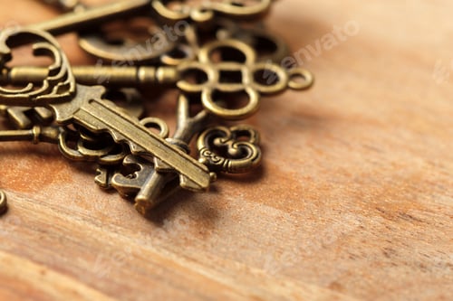 Preview: Vintage keys scattered on a wooden surface, highlighting their intricate designs and textures