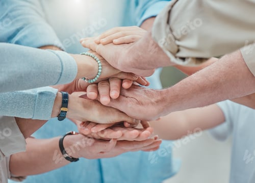 Preview: Blessed with the best team. Shot of a family stacking their hands in the garden outside.