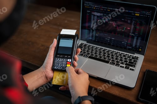 Preview: Man hands holding credit card and using laptop or smart phone Online shopping Website.