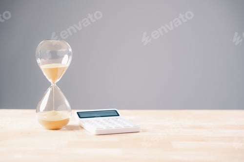 Preview: Hourglass sand flows showing tax time running short, calculator awaits business money calculation,