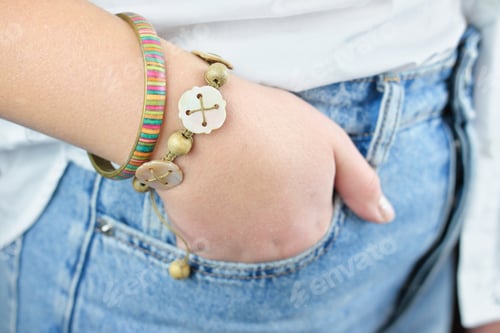 Preview: teenager girl's hand with hipster style bracelets