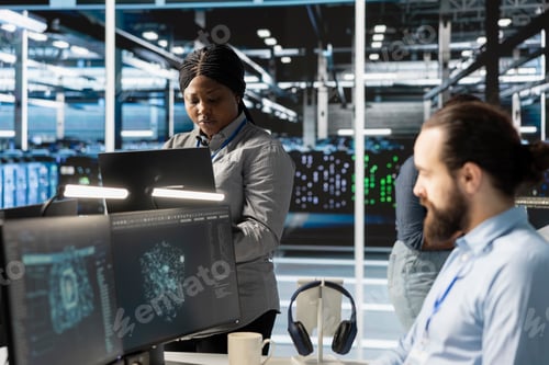 Preview: Engineers doing maintenance on blade servers supplying compute power