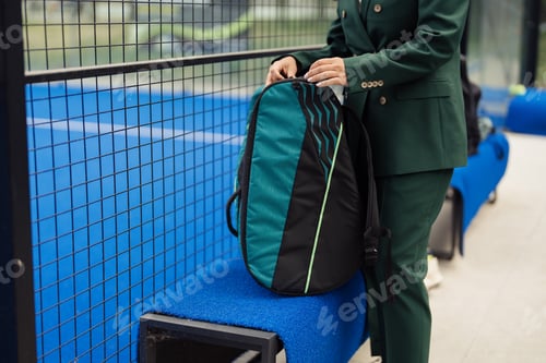 Preview: Person with stylish padel tennis bag on court bench