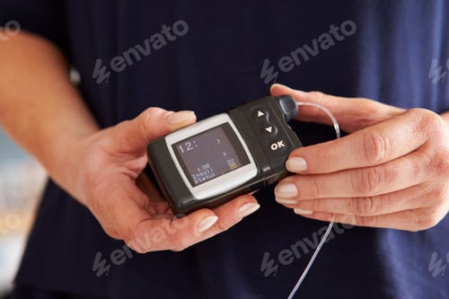 Preview: Male Diabetic Checking Blood Sugar Levels
