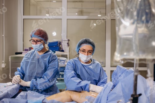 Preview: Surgeons Performing a Surgical Procedure in Hospital Setting