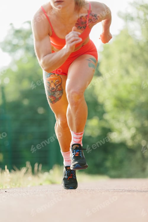 Preview: Strong athletic woman running for outdoor training