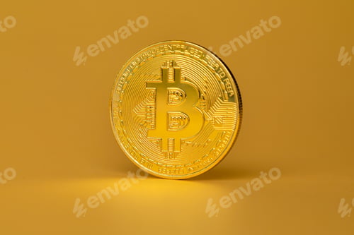 Vista previa: Moneda criptográfica de Bitcoin sobre fondo dorado
