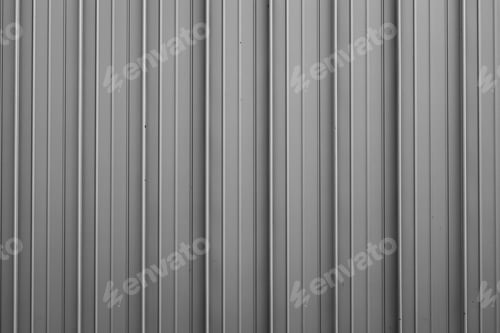 Preview: Front view of gray ribbed metal surface on fence or wall for backdrop
