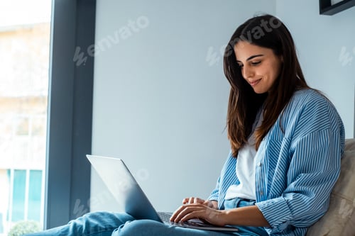 Preview: Woman Working At Home On Her Laptop
