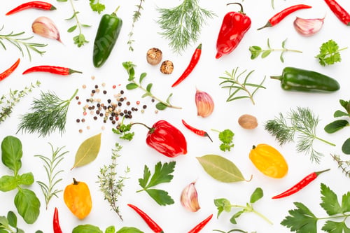 Preview: Spice herbal leaves and chili pepper on white background.
