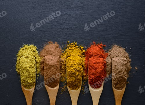 Preview: colorful herbs and spices in wooden spoons
