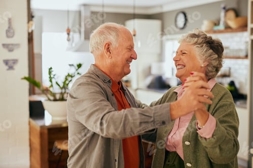 Preview: Loving senior couple dancing at home with joy