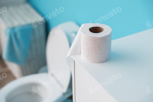 Preview: Toilet paper roll on cabinet in bathroom. Space for text