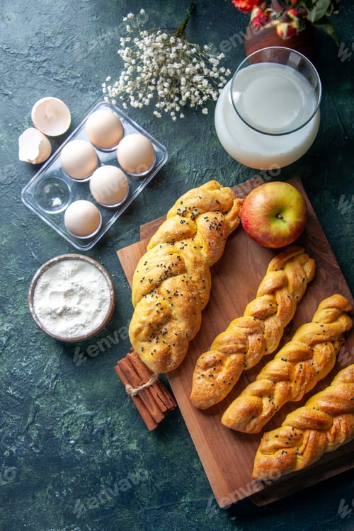 Preview: top view fresh chicken eggs with pastry and milk on dark background bread food meal breakfast