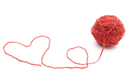 Preview: Heart shape and wool ball on white background