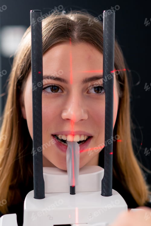 Preview: portrait of a beautiful woman doing a 3D scan of the nose and oral cavity in plastic surgery clinic