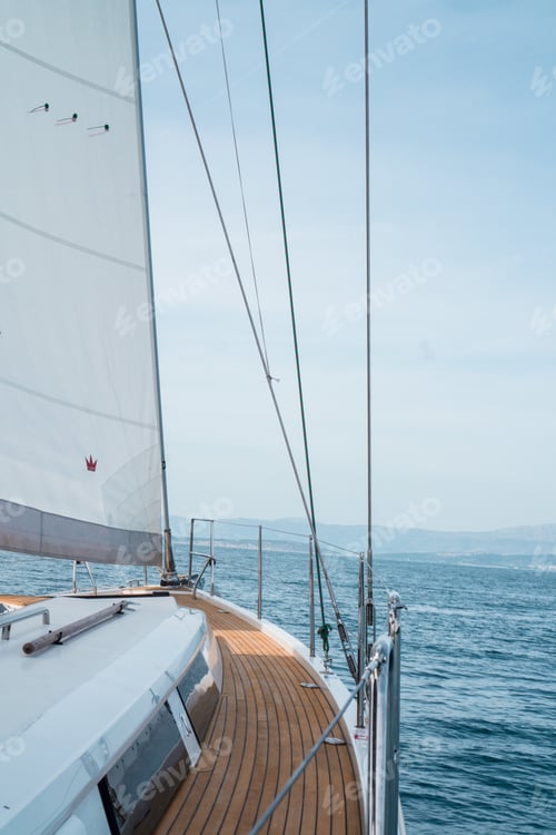 Preview: Vertical shot of a sailing ship on the sea under a cloudy sky in Croatia