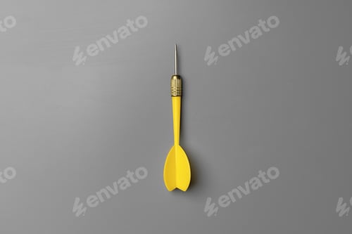 Preview: Yellow dart arrow on gray background copy space