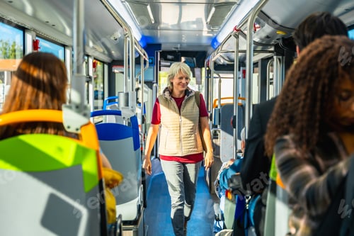 Preview: Senior woman commuting inside a public transport bus
