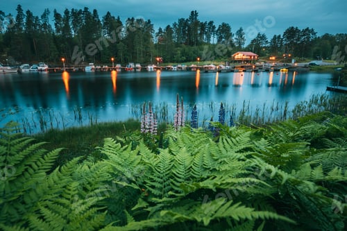 Preview: Sweden. Beautiful Red Swedish Wooden Log Cabin House And Pier Ne