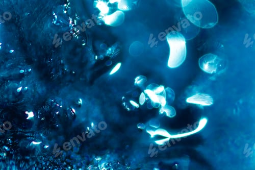 Preview: Macro shot of melting snow flowing on a windscreen