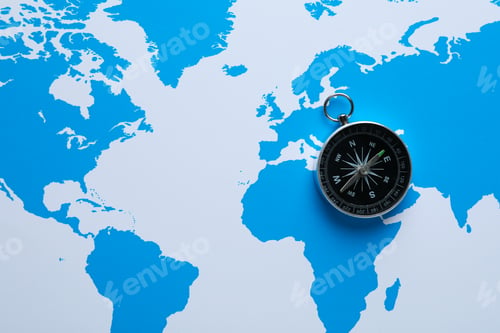 Preview: Compass on the background of the world map.