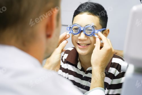 Preview: Man examining eyesight in optical clinic.
