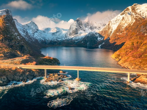 Preview: Aerial view of bridge crossing the fjord with snowy mountains