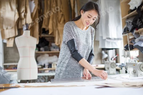 Preview: Fashion designer working in studio