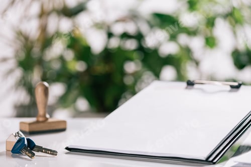 Preview: selective focus of keys and clipboard on white desk, mortgage concept