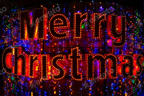 Preview: Merry Christmas word neon sign. Christmas lights in night city.