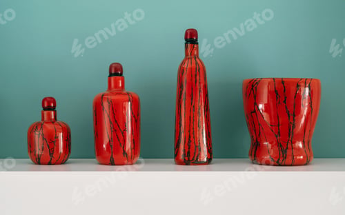 Preview: Four red Murano glass items with black stripes on a white shelf